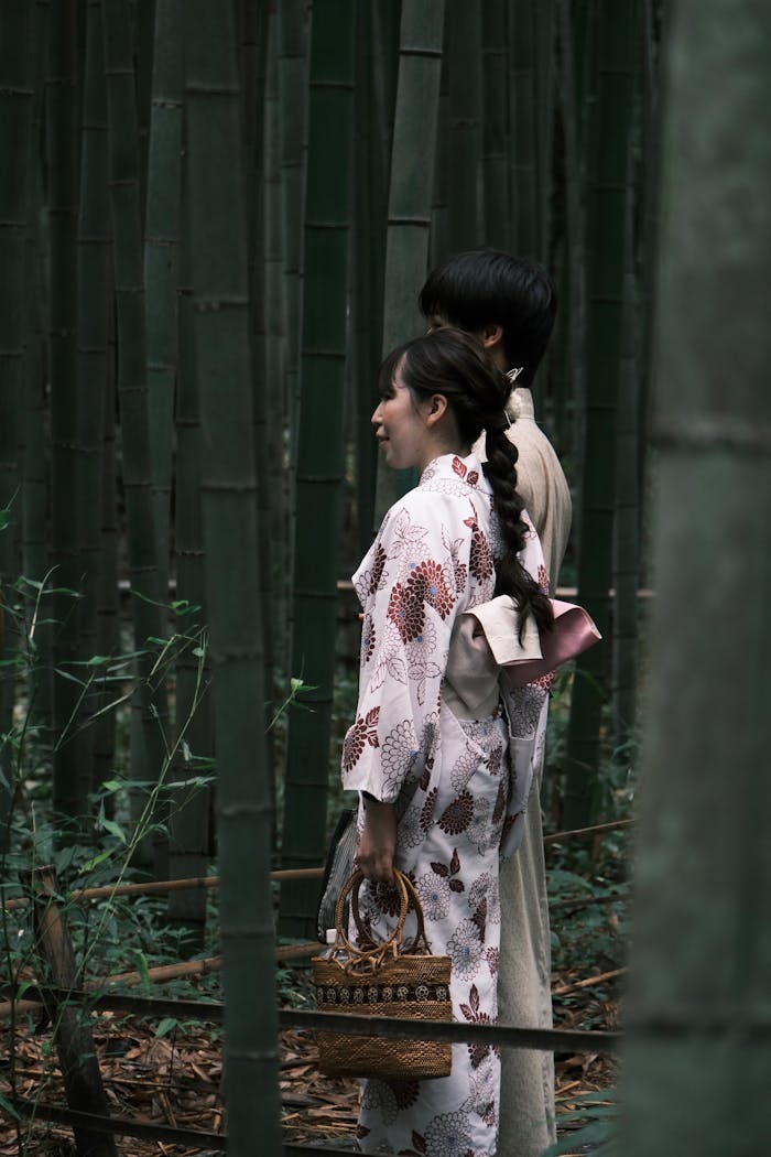 Couple in Traditional Clothes in Bamboo Forest